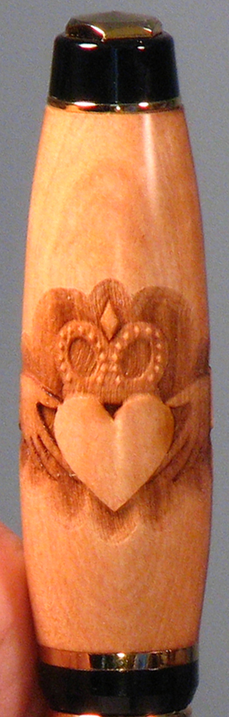 Top half of pen showing Claddagh